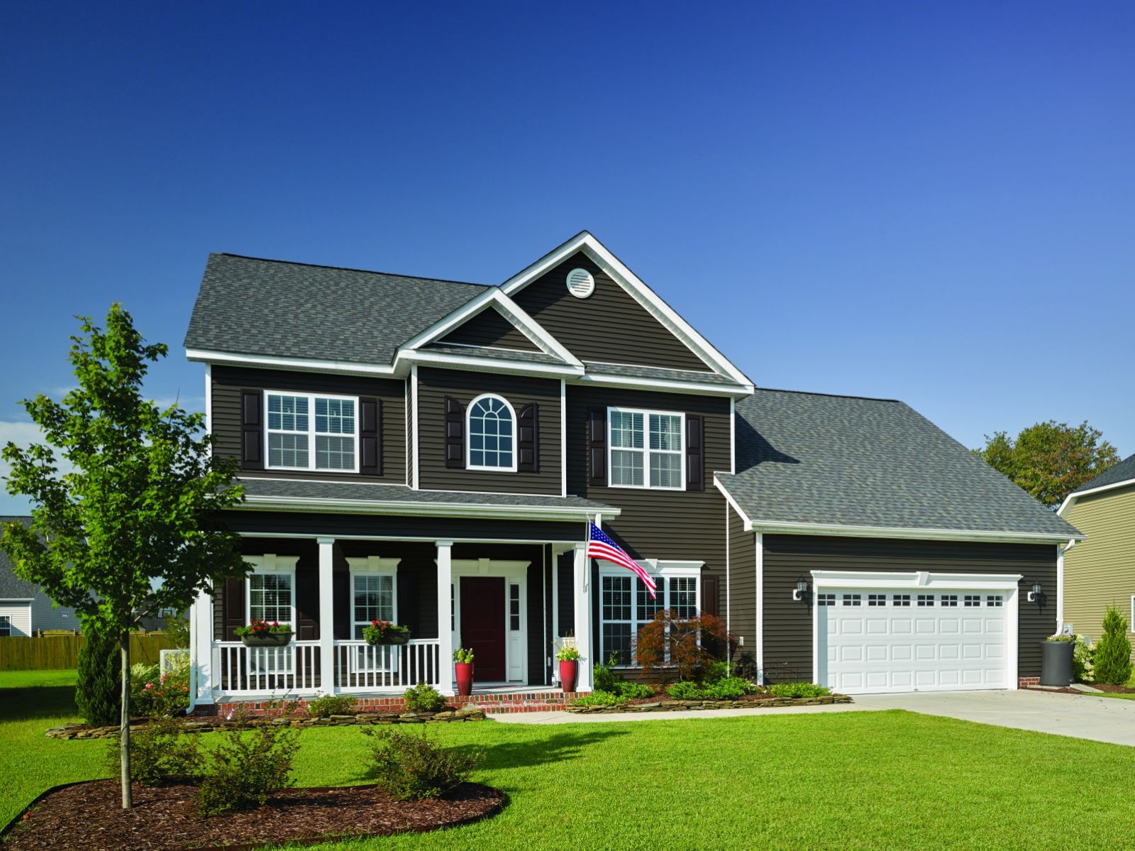 Dark gray Certainteed siding on a new residential home